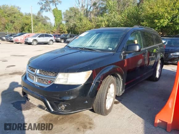 2014 Dodge Journey SXT with VIN 3C4PDCBB0ET124864, listed as a IAAI auction lot 43333855 with 208,280 mi miles and . Bid and sale history available at DreamBid. Image 2.