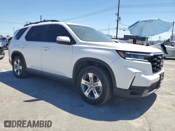 2023 Honda Pilot EX-L z VIN 5FNYG2H51PB016228, wystawiony jako Copart lot #63607195 z przebiegiem 32 468 mil mil oraz Szkoda całkowita • Salvage title. Historia ofert i sprzedaży dostępna na DreamBid. Obrazek 4.