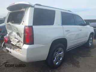 2015 Chevrolet Tahoe LTZ with VIN 1GNSKCKC1FR690803, listed as a IAAI auction lot 43335116 with 223,442 mi miles and . Bid and sale history available at DreamBid. Image 4.