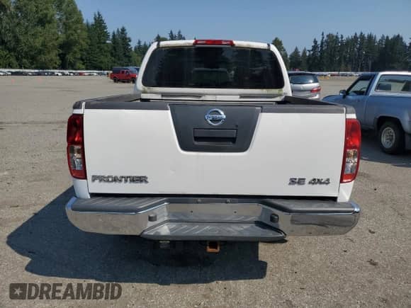 2009 Nissan Frontier SE with VIN 1N6AD07W79C403937, listed as a Copart auction lot 71112695 with 203,010 mi miles and Salvage title. Bid and sale history available at DreamBid. Image 6.