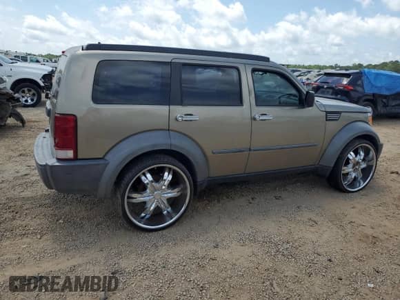 2007 Dodge Nitro SXT with VIN 1D8GT28K47W606529, listed as a Copart auction lot 54737475 with 176,695 mi miles and Salvage title. Bid and sale history available at DreamBid. Image 3.