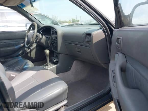 1995 Toyota Camry LE z VIN JT2SK12E1S0330730, wystawiony jako IAAI lot #42916715 z przebiegiem 139 883 mil mil oraz . Historia ofert i sprzedaży dostępna na DreamBid. Obrazek 5.