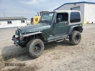 2003 Jeep Wrangler Rubicon z VIN 1J4FA69S43P327618, wystawiony jako Copart lot #70574135 z przebiegiem 111 917 mil mil oraz Szkoda całkowita • Salvage title. Historia ofert i sprzedaży dostępna na DreamBid. Obrazek 1.