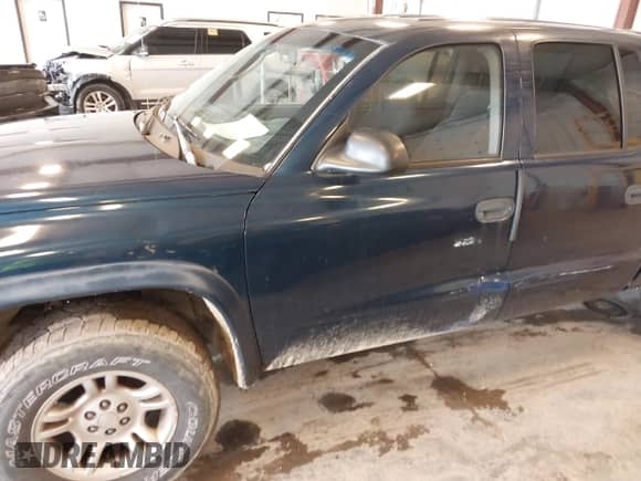 2003 Dodge Dakota SLT with VIN 1D7HL48N63S177233, listed as a IAAI auction lot 42167711 with 163,511 mi miles and . Bid and sale history available at DreamBid. Image 6.