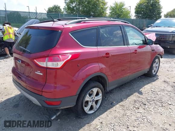 2014 Ford Escape SE with VIN 1FMCU0GXXEUC10668, listed as a IAAI auction lot 42972752 with 171,827 mi miles and . Bid and sale history available at DreamBid. Image 4.