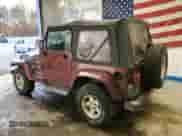 2001 Jeep Wrangler Sahara z VIN 1J4FA59S11P334534, wystawiony jako Copart lot #90651005 z przebiegiem 155 822 mil mil oraz Czysty tytuł • Clean title. Historia ofert i sprzedaży dostępna na DreamBid. Obrazek 2.