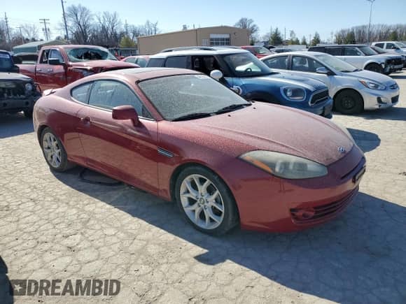 2007 Hyundai Tiburon GT with VIN KMHHN66F27U255380, listed as a Copart auction lot 48105165 with 142,966 mi miles and Salvage title. Bid and sale history available at DreamBid. Image 4.