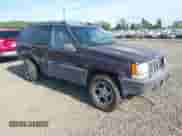 1996 Jeep Grand Cherokee Laredo z VIN 1J4GZ58S2TC262980, wystawiony jako IAAI lot #41949514 z przebiegiem 269 674 mil mil oraz . Historia ofert i sprzedaży dostępna na DreamBid. Obrazek 1.