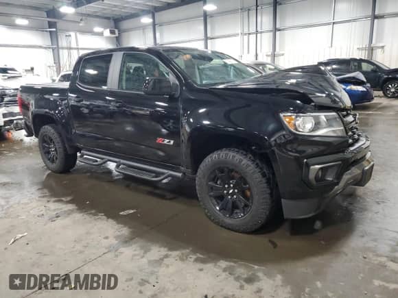 2021 Chevrolet Colorado 4WD Z71 with VIN 1GCGTDEN8M1171810, listed as a Copart auction lot 57409115 with 100,579 mi miles and Salvage title. Bid and sale history available at DreamBid. Image 4.