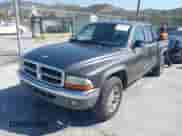 2004 Dodge Dakota SLT with VIN 1D7HL48K24S618072, listed as a IAAI auction lot 42001943 with 202,449 mi miles and . Bid and sale history available at DreamBid. Image 2.