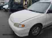 1999 Hyundai Accent GL z VIN KMHVF24N1XU583604, wystawiony jako IAAI lot #41613240 z przebiegiem 163 938 mil mil oraz . Historia ofert i sprzedaży dostępna na DreamBid. Obrazek 13.