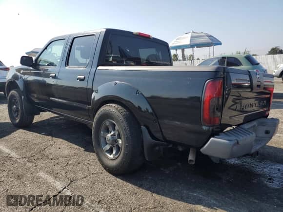 2004 Nissan Frontier XE with VIN 1N6ED27T64C477426, listed as a Copart auction lot 68329535 with 132,259 mi miles and Salvage title. Bid and sale history available at DreamBid. Image 2.