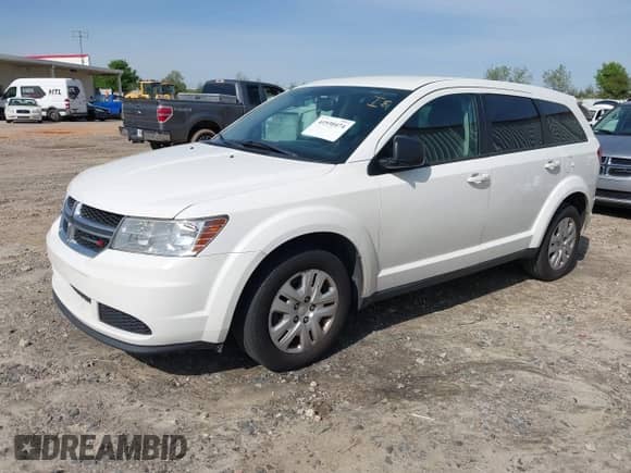 2015 Dodge Journey American Value z VIN 3C4PDCAB8FT605870, wystawiony jako IAAI lot #41930474 z przebiegiem 205 741 mil mil oraz . Historia ofert i sprzedaży dostępna na DreamBid. Obrazek 2.