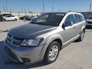 2016 Dodge Journey SXT with VIN 3C4PDCBG7GT202670, listed as a Copart auction lot 82617005 with 163,106 mi miles and Salvage title. Bid and sale history available at DreamBid. Image 1.