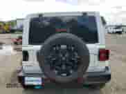 2022 Jeep Wrangler Unlimited Sahara with VIN 1C4JJXP69NW223291, listed as a Copart auction lot 64458055 with 24,574 mi miles and Salvage title. Bid and sale history available at DreamBid. Image 6.