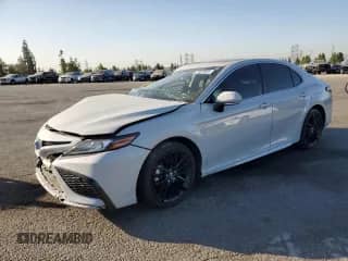 2023 Toyota Camry Hybrid XSE с VIN 4T1K31AK4PU059220, выставлен на аукционе Copart как лот 71520905 с пробегом 45 489 миль миль и Списание • Salvage title. История ставок и продаж доступна на DreamBid. Изображение 1.