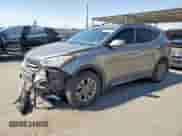 2015 Hyundai Santa Fe z VIN 5XYZUDLB7FG277523, wystawiony jako Copart lot #70217515 z przebiegiem 136 683 mil mil oraz Szkoda całkowita • Salvage title. Historia ofert i sprzedaży dostępna na DreamBid. Obrazek 1.