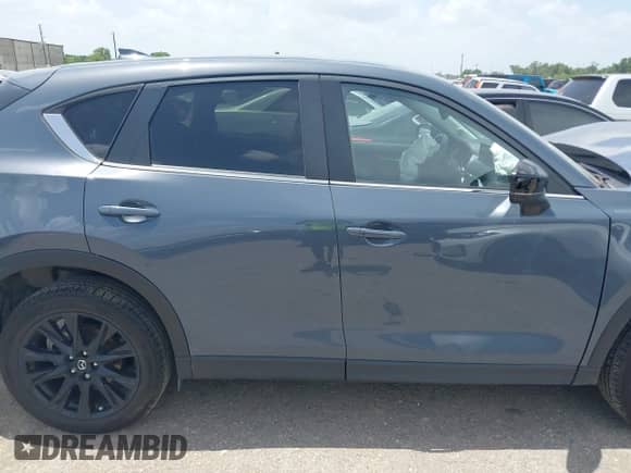 2022 Mazda CX-5 S Carbon Edition z VIN JM3KFBCM2N0571117, wystawiony jako IAAI lot #42535593 z przebiegiem 33 735 mil mil oraz . Historia ofert i sprzedaży dostępna na DreamBid. Obrazek 13.
