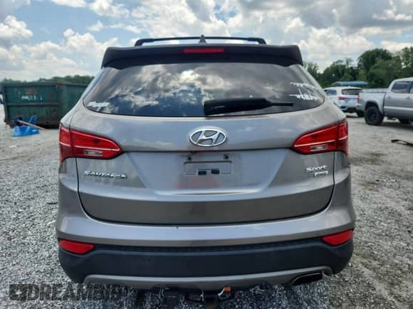 2015 Hyundai Santa Fe z VIN 5XYZUDLB1FG294690, wystawiony jako Copart lot #65039015 z przebiegiem 144 835 mil mil oraz Szkoda całkowita • Salvage title. Historia ofert i sprzedaży dostępna na DreamBid. Obrazek 6.