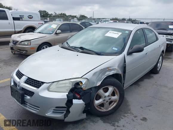 2004 Dodge Stratus SXT z VIN 1B3EL46R14N361340, wystawiony jako IAAI lot #41704096 z przebiegiem 102 557 mil mil oraz . Historia ofert i sprzedaży dostępna na DreamBid. Obrazek 2.