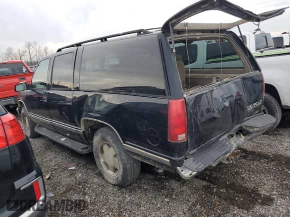 1997 Chevrolet Suburban with VIN 3GNFK16R5VG178674, listed as a Copart auction lot 80760694 with 248,492 mi miles and Salvage title. Bid and sale history available at DreamBid. Image 2.