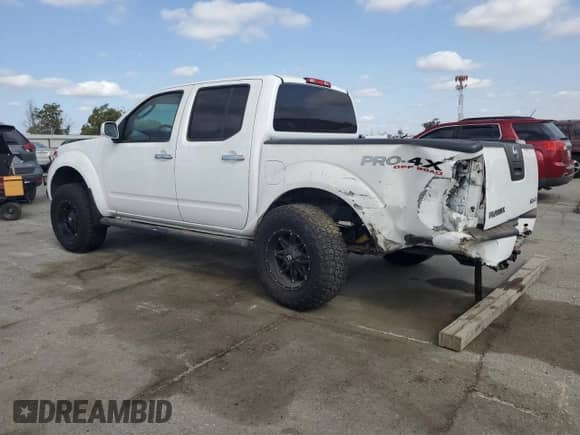 2010 Nissan Frontier LE with VIN 1N6AD0EV6AC433378, listed as a Copart auction lot 72017405 with 153,257 mi miles and Salvage title. Bid and sale history available at DreamBid. Image 2.