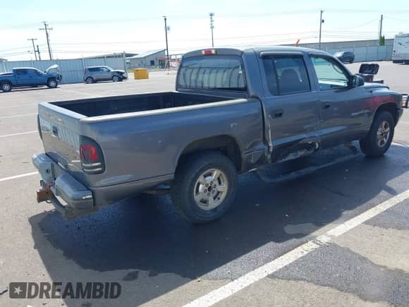 2002 Dodge Dakota Sport with VIN 1B7HL38X42S661356, listed as a IAAI auction lot 42451112 with Not provided miles and . Bid and sale history available at DreamBid. Image 4.