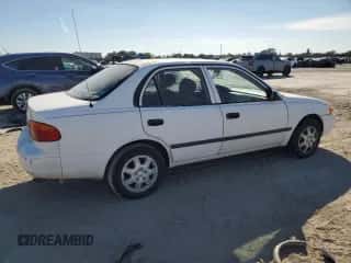 2001 Chevrolet Prizm с VIN 1Y1SK52851Z415813, выставлен на аукционе Copart как лот 87837865 с пробегом Не указан миль и Списание • Salvage title. История ставок и продаж доступна на DreamBid. Изображение 3.