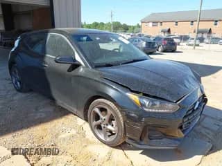 2021 Hyundai Veloster 2.0 z VIN KMHTG6AF0MU032598, wystawiony jako IAAI lot #42125040 z przebiegiem 82 250 mil mil oraz . Historia ofert i sprzedaży dostępna na DreamBid. Obrazek 1.