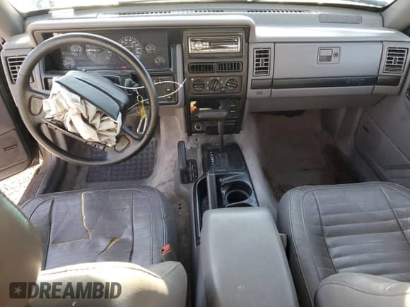1994 Jeep Grand Cherokee Laredo with VIN 1J4GZ58Y6RC275647, listed as a Copart auction lot 81818255 with 147,486 mi miles and Salvage title. Bid and sale history available at DreamBid. Image 8.