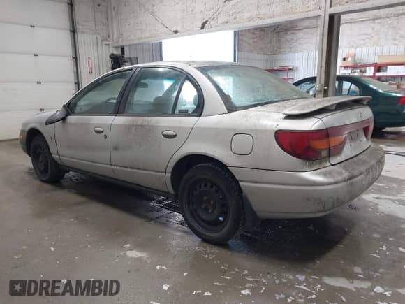 2001 Saturn SL with VIN 1G8ZJ54751Z324075, listed as a IAAI auction lot 43387665 with Not provided miles and . Bid and sale history available at DreamBid. Image 3.