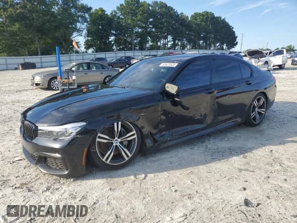 2018 BMW 7 Series 740i с VIN WBA7E2C55JB214956, выставлен на аукционе Copart как лот 63423525 с пробегом 88 274 миль миль и Списание • Salvage title. История ставок и продаж доступна на DreamBid. Изображение 1.