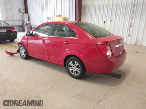 2012 Chevrolet Sonic LT z VIN 1G1JD5SB0C4223455, wystawiony jako IAAI lot #41913799 z przebiegiem 139 919 mil mil oraz . Historia ofert i sprzedaży dostępna na DreamBid. Obrazek 3.