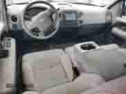 2005 Ford F-150 XLT with VIN 1FTPX12595NA46140, listed as a Copart auction lot 82141515 with 156,879 mi miles and Salvage title. Bid and sale history available at DreamBid. Image 8.