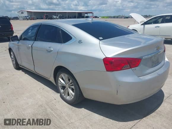 2015 Chevrolet Impala LT z VIN 2G1125S35F9182210, wystawiony jako IAAI lot #42883793 z przebiegiem 127 771 mil mil oraz . Historia ofert i sprzedaży dostępna na DreamBid. Obrazek 3.