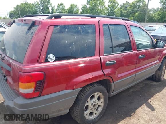 2002 Jeep Grand Cherokee Sport with VIN 1J4GW38S72C276689, listed as a IAAI auction lot 42586977 with 360,258 mi miles and . Bid and sale history available at DreamBid. Image 4.