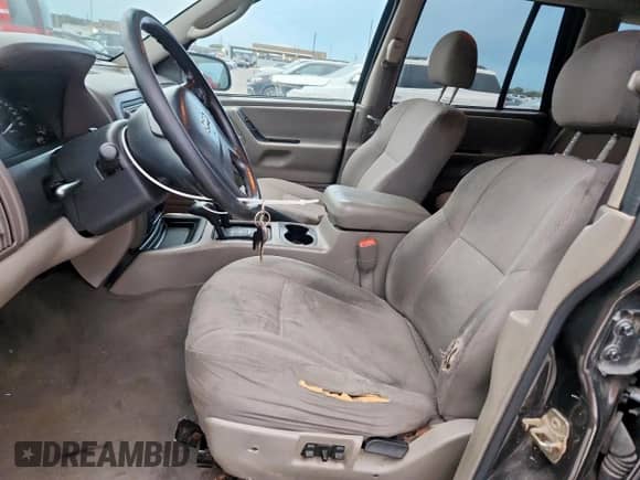 2004 Jeep Grand Cherokee Laredo with VIN 1J4GW48S84C361744, listed as a Copart auction lot 91091115 with 236,095 mi miles and Clean title. Bid and sale history available at DreamBid. Image 7.
