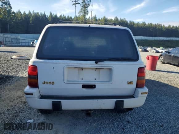 1993 Jeep Grand Cherokee Limited z VIN 1J4GZ78Y1PC697768, wystawiony jako Copart lot #85178745 z przebiegiem 152 032 mil mil oraz Szkoda całkowita • Salvage title. Historia ofert i sprzedaży dostępna na DreamBid. Obrazek 6.