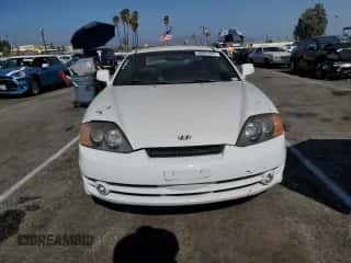 2004 Hyundai Tiburon GT с VIN KMHHN65FX4U134688, выставлен на аукционе Copart как лот 68931044 с пробегом 30 107 миль миль и Списание • Salvage title. История ставок и продаж доступна на DreamBid. Изображение 5.