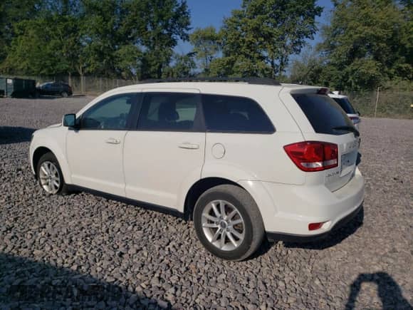 2014 Dodge Journey SXT with VIN 3C4PDCBG3ET118732, listed as a Copart auction lot 68508215 with 118,897 mi miles and Salvage title. Bid and sale history available at DreamBid. Image 2.
