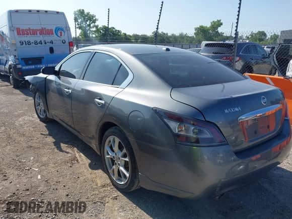 2014 Nissan Maxima SV with VIN 1N4AA5AP6EC443310, listed as a IAAI auction lot 42373390 with 146,828 mi miles and . Bid and sale history available at DreamBid. Image 3.