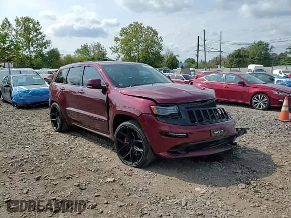 2016 Jeep Grand Cherokee SRT with VIN 1C4RJFDJ2GC373382, listed as a Copart auction lot 81557365 with 98,697 mi miles and Salvage title. Bid and sale history available at DreamBid. Image 14.