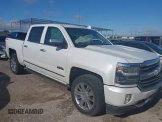 2016 Chevrolet Silverado 1500 High Country z VIN 3GCUKTEC1GG191501, wystawiony jako IAAI lot #42346966 z przebiegiem 142 997 mil mil oraz . Historia ofert i sprzedaży dostępna na DreamBid. Obrazek 1.