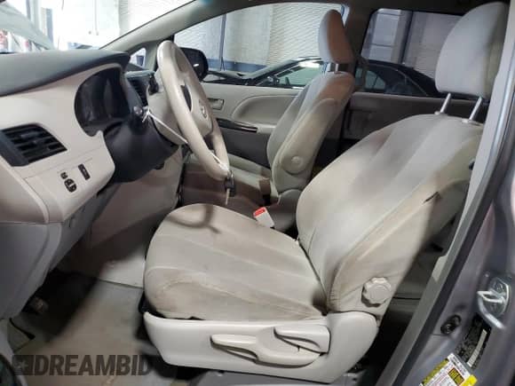 2012 Toyota Sienna with VIN 5TDZK3DC3CS240569, listed as a Copart auction lot 63664415 with 129,329 mi miles and Salvage title. Bid and sale history available at DreamBid. Image 7.