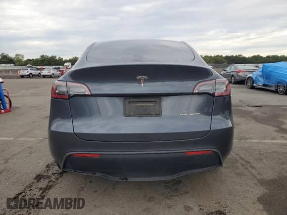 2023 Tesla Model Y Long Range with VIN 7SAYGDEE6PF693505, listed as a Copart auction lot 81774175 with 32,396 mi miles and Salvage title. Bid and sale history available at DreamBid. Image 6.