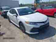 2021 Toyota Camry Hybrid XLE with VIN 4T1F31AKXMU556673, listed as a IAAI auction lot 42018439 with 56,429 mi miles and . Bid and sale history available at DreamBid. Image 1.