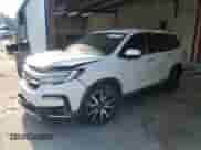 2020 Honda Pilot Touring 7-Passenger z VIN 5FNYF5H63LB011474, wystawiony jako Copart lot #62547135 z przebiegiem 100 676 mil mil oraz Szkoda całkowita • Salvage title. Historia ofert i sprzedaży dostępna na DreamBid. Obrazek 1.