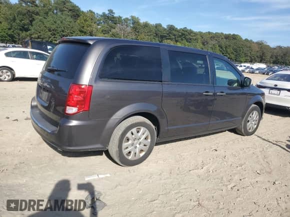 2019 Dodge Grand Caravan SE with VIN 2C4RDGBGXKR737505, listed as a Copart auction lot 82255895 with 124,359 mi miles and Salvage title. Bid and sale history available at DreamBid. Image 3.
