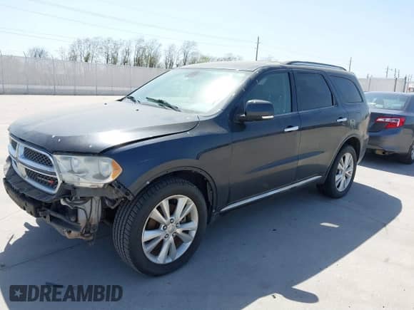 2013 Dodge Durango Crew with VIN 1C4SDHDT5DC637535, listed as a IAAI auction lot 41867982 with 162,569 mi miles and . Bid and sale history available at DreamBid. Image 2.
