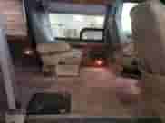 2001 Ford Econoline Cargo Recreational with VIN 1FDRE14L71HA69804, listed as a Copart auction lot 64798505 with 150,447 mi miles and Salvage title. Bid and sale history available at DreamBid. Image 11.